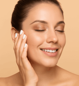 girl with contoured and beautiful look smiling closing eyes