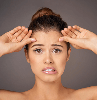 a woman with wierd expression due to thread lift treatment going wrong