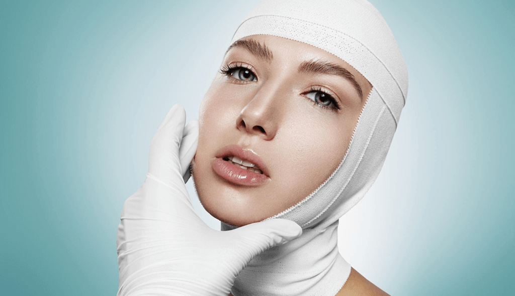a woman with white bandages on head