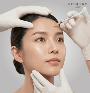 hands of doctors with white gloves injecting botox in a woman forehead