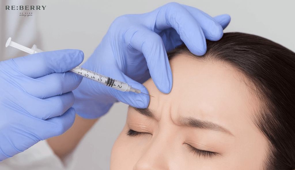 a doctor wearing blue gloves injection botox in face of a woman