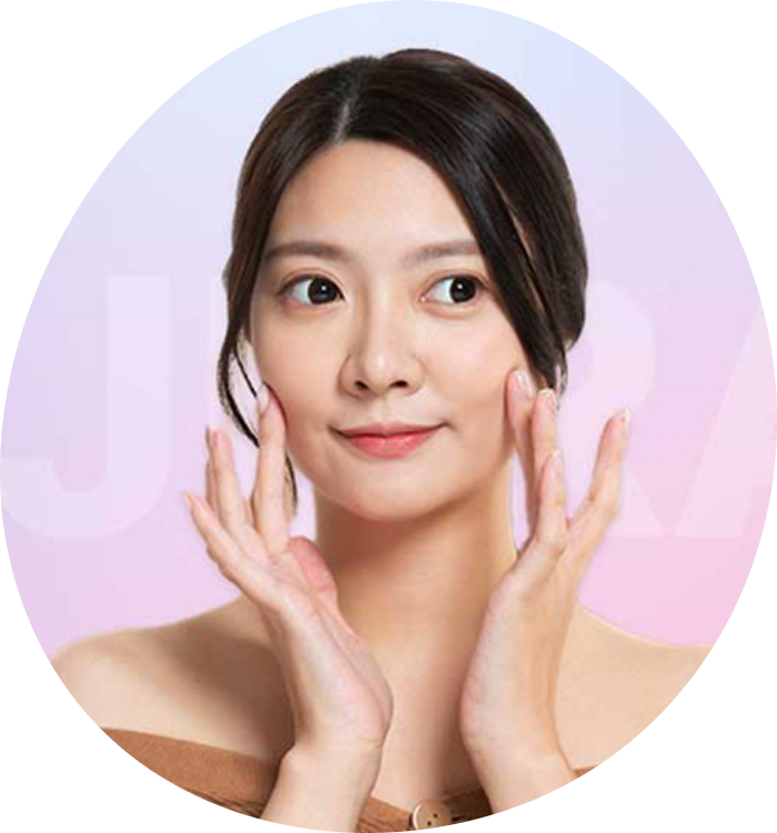 a young korean girl gently touching her cheeks with fingers