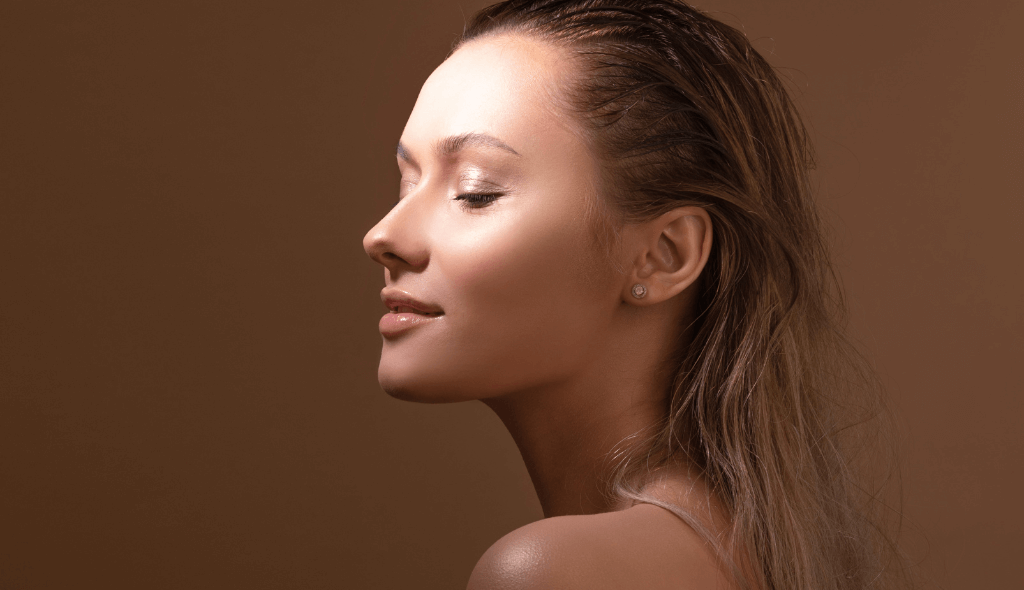 a woman with fresh and firm skin and a gentle sun ray on forehead