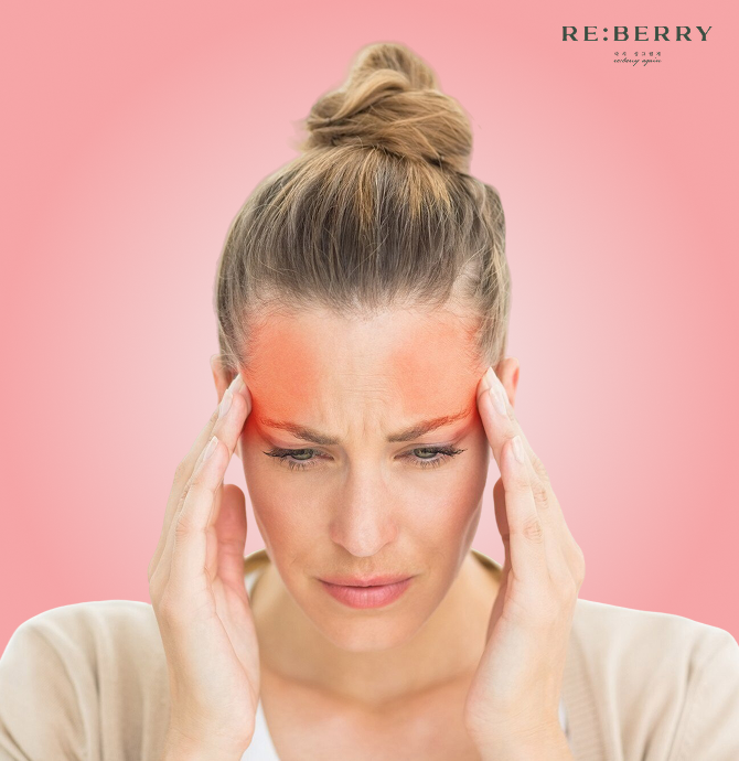 Woman with highlighted forehead pain illustrating headache as a Botox side effect