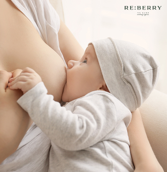a mother breastfeeding her baby
