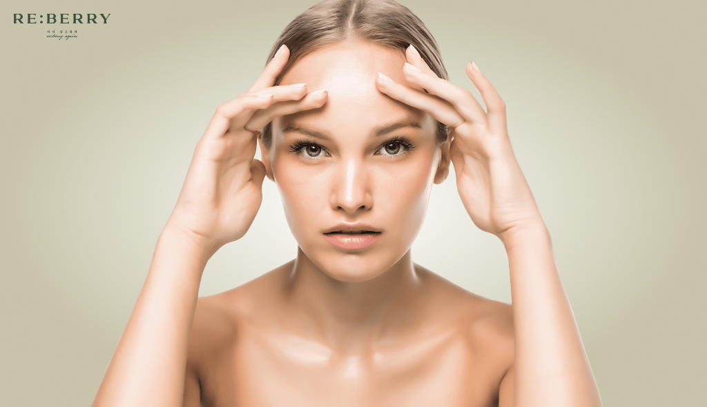 a girl sitting with fingers on forehead front view