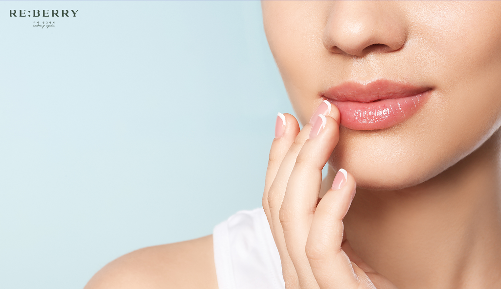 a woman touching her lips with fingers