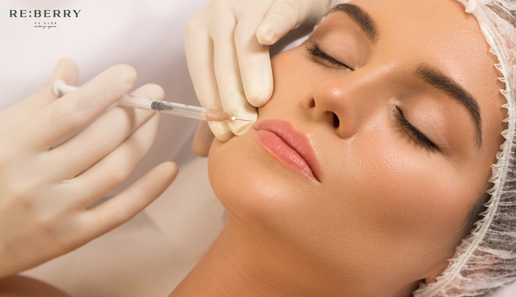 doctor giving botox injectoin to a woman sleeping closing eyes