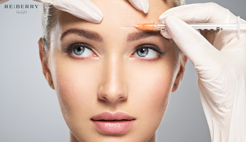 a girl getting botox injection on forehead