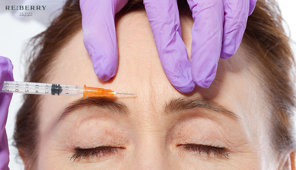 a women getting botox injection at frown lines in her 50s