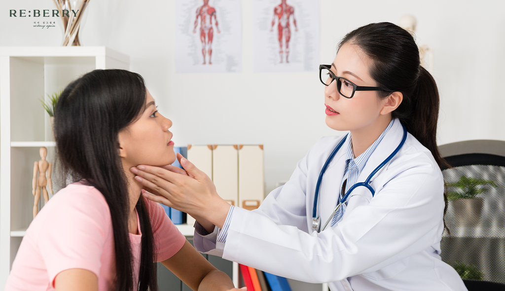 a doctor assessing facial skin of a woman for rejuran healer injection
