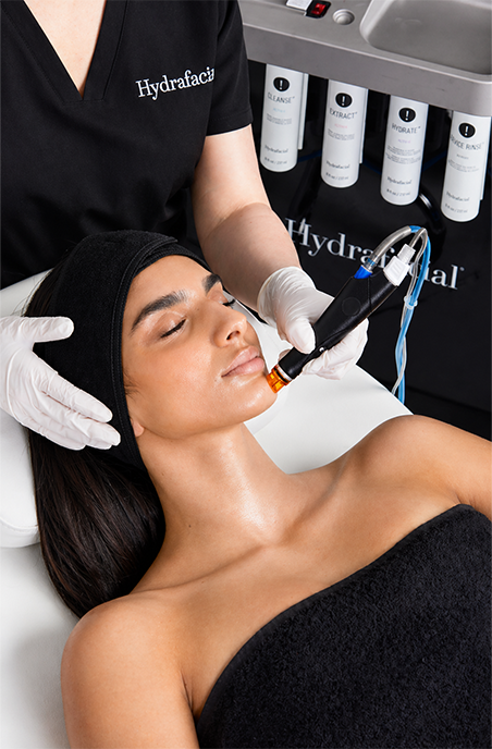 a woman getting hydrafacial treatment